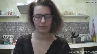 Solo girl with glasses chatting in the kitchen