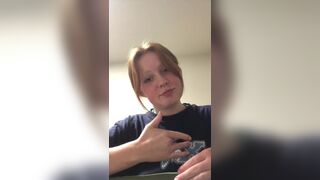 Redhead teen recording ASL project