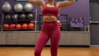 Fitness Girl Flexing Biceps