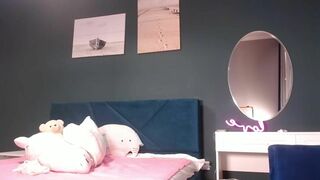 Lina_Tyan WEBCUM show - legs spread on her bed.