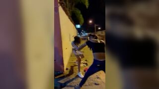 Hookers fight in the street.